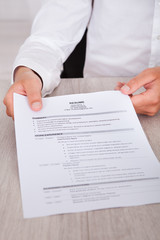 Businessman Holding Resume
