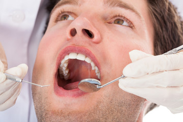 Dentist Examining Patient