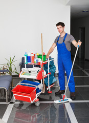 Young Man With Cleaning Equipment