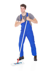 Young Man Cleaning With Mop