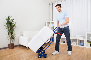 Young Man With Box On Trolley