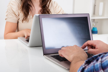 Couple Using Laptop