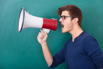 Young Man Shouting In Megaphone