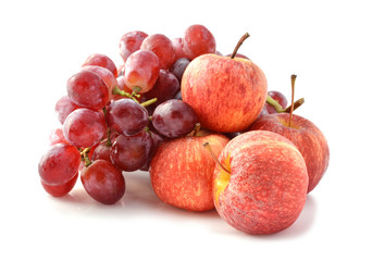 ripe red apples and grapes isolated on white close-up