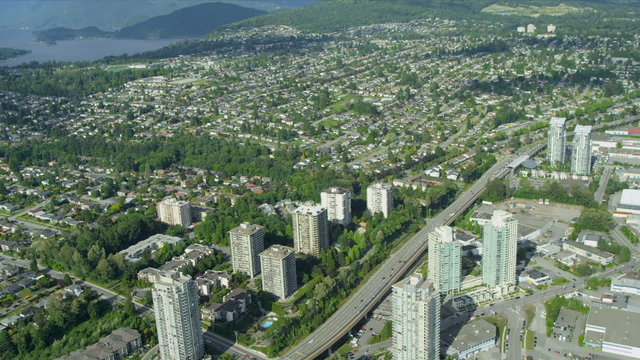 Aerial view Trans Canada Highway passing residential suburbs, Vancouver