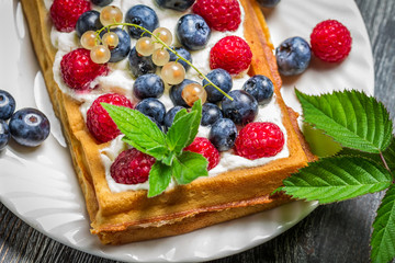 Waffels with cream and blueberry and raspberry