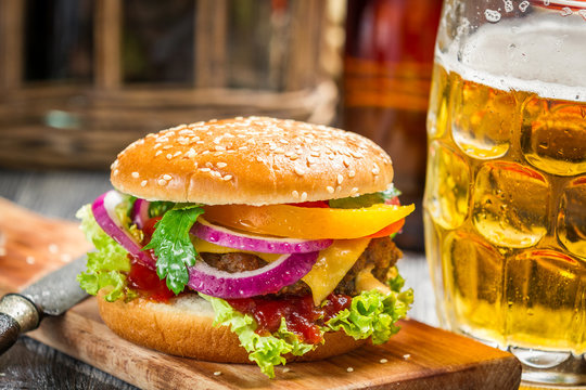 Closeup Of Fresh Burger And A Cold Beer