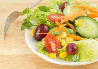 Fresh vegetable salad on white plate