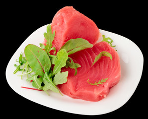 Tuna steaks with salad isolated on black