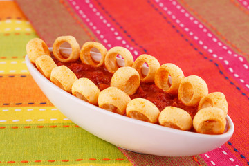 Potato rings and red sauce