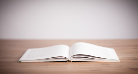 Open book on wooden deck