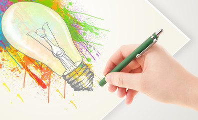 Hand drawing colorful idea light bulb with a pen