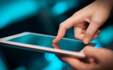 Finger pointing on tablet pc with empty space