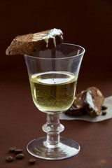 Chocolate biscotti with a glass of white wine.