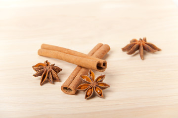 cinnamon and star anise on wooden background