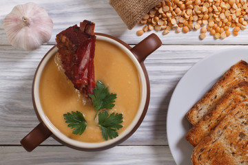 pea soup with smoked meat and ingredients. top view