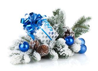 Fototapeta na wymiar Gift box and christmas decor on snowy fir tree