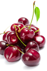 Close up of heap of cherry, isolated on white background