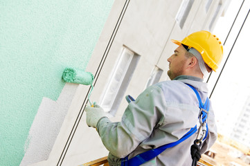 builder facade painter at work