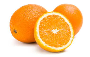 Close up of three oranges and one is cut, isolated 
