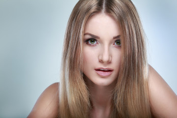 Fototapeta premium Beautiful girl, isolated on a light-grey, emotions, cosmetics