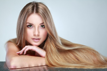 Beautiful  girl, isolated on a light-grey, emotions, cosmetics