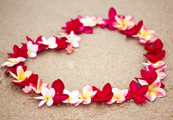 Flower love symbol on sand