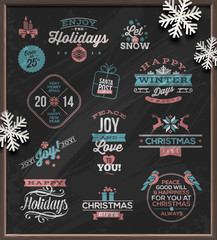 Christmas holidays signs, emblems and greetings on a chalkboard © sergo77