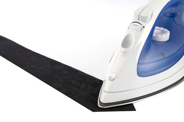 Electric iron and black tie