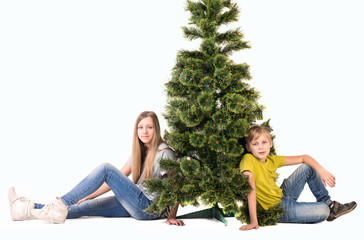 Boy and girl sitting under the tree