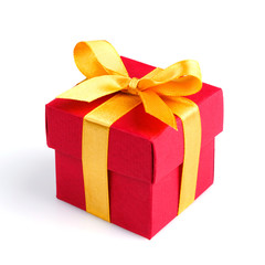 Single red gift box with golden ribbon