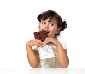 child eating chocolate