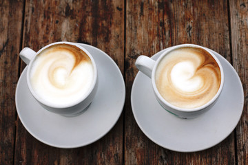 two cups of coffee cappuccino