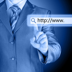 Businessman pushing virtual search bar