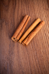 cinnamon sticks on wooden background