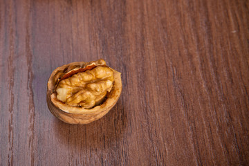 chopped walnuts on a wooden background