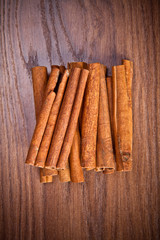 cinnamon sticks on wooden background