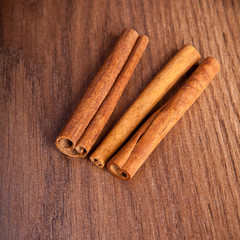 cinnamon sticks on wooden background