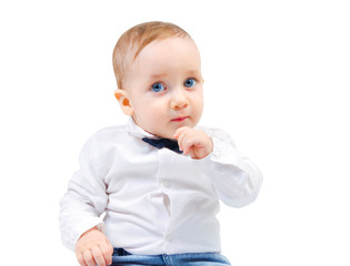 Cute child thoughtfully looks