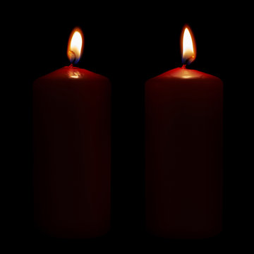 Two lighted candles isolated