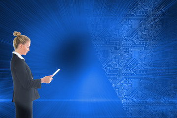 Composite image of businesswoman holding new tablet
