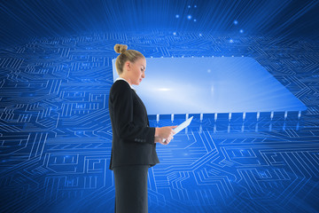 Composite image of businesswoman holding new tablet