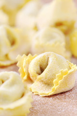 Obraz na płótnie Canvas fresh homemade Italian filled pasta - tortellini or ravioli