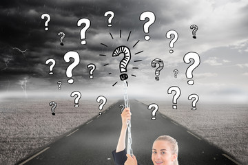 Composite image of businesswoman pulling a chain