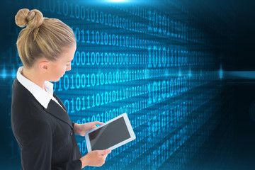 Composite image of businesswoman holding tablet