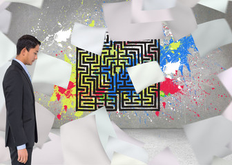 Composite image of serious asian businessman