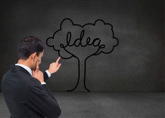 Composite image of thoughtful asian businessman pointing