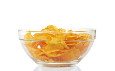 Delicious potato chips in glass bowl