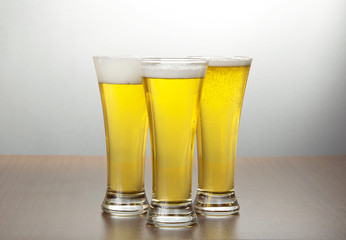 Three glasses of light beer