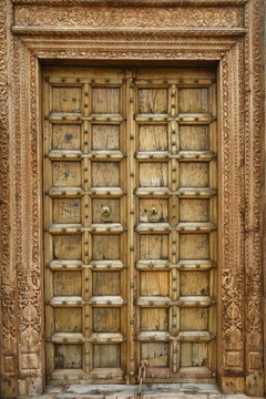 Wooden door with ancient floral patten.